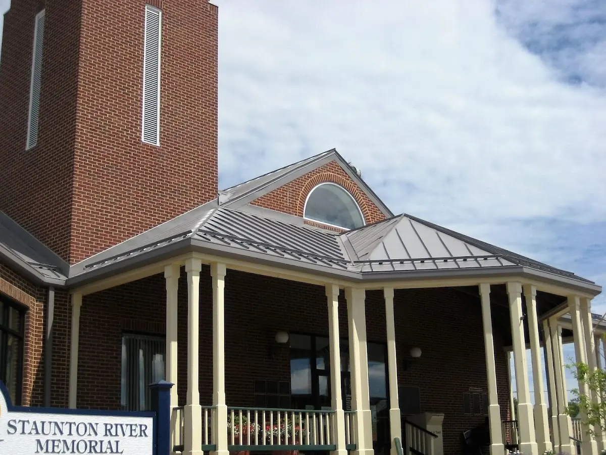 Skilled roofing craftsmen working on a residential roof in Huntington South